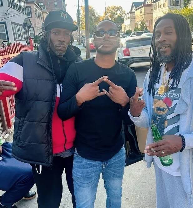 MINDBENDA with two companions on a residential street